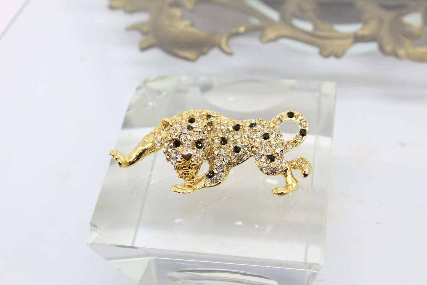 Gold Plated Leopard Brooch with Clear and Black Rhinestones circa 1980s