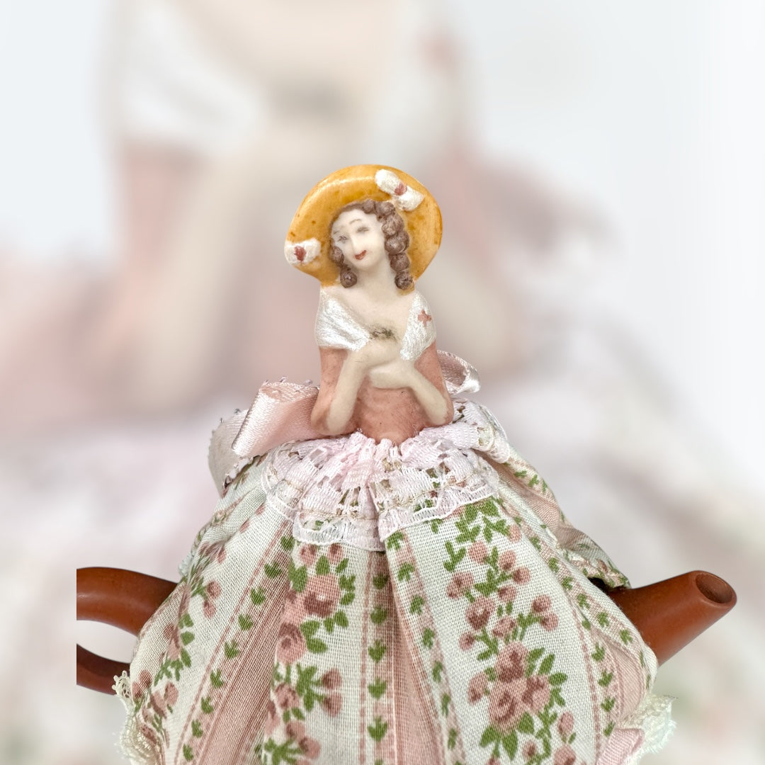Chinese Clay teapot with porcelain doll tea cover