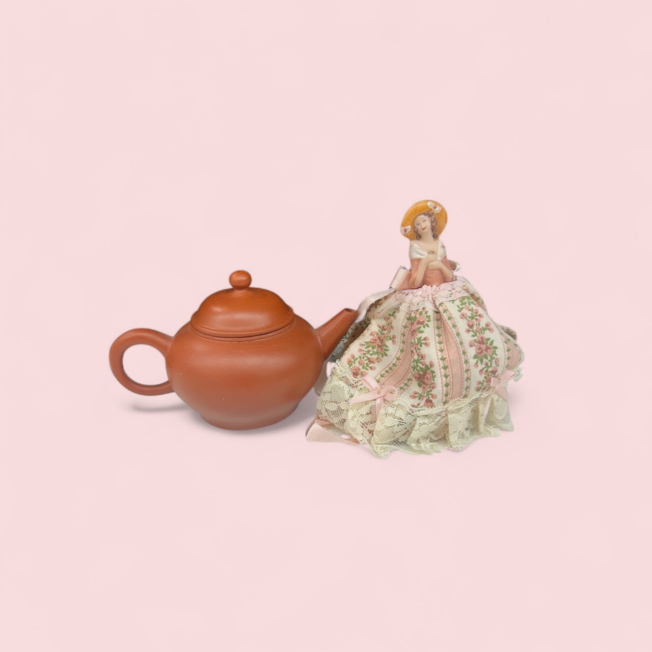 Chinese Clay teapot with porcelain doll tea cover