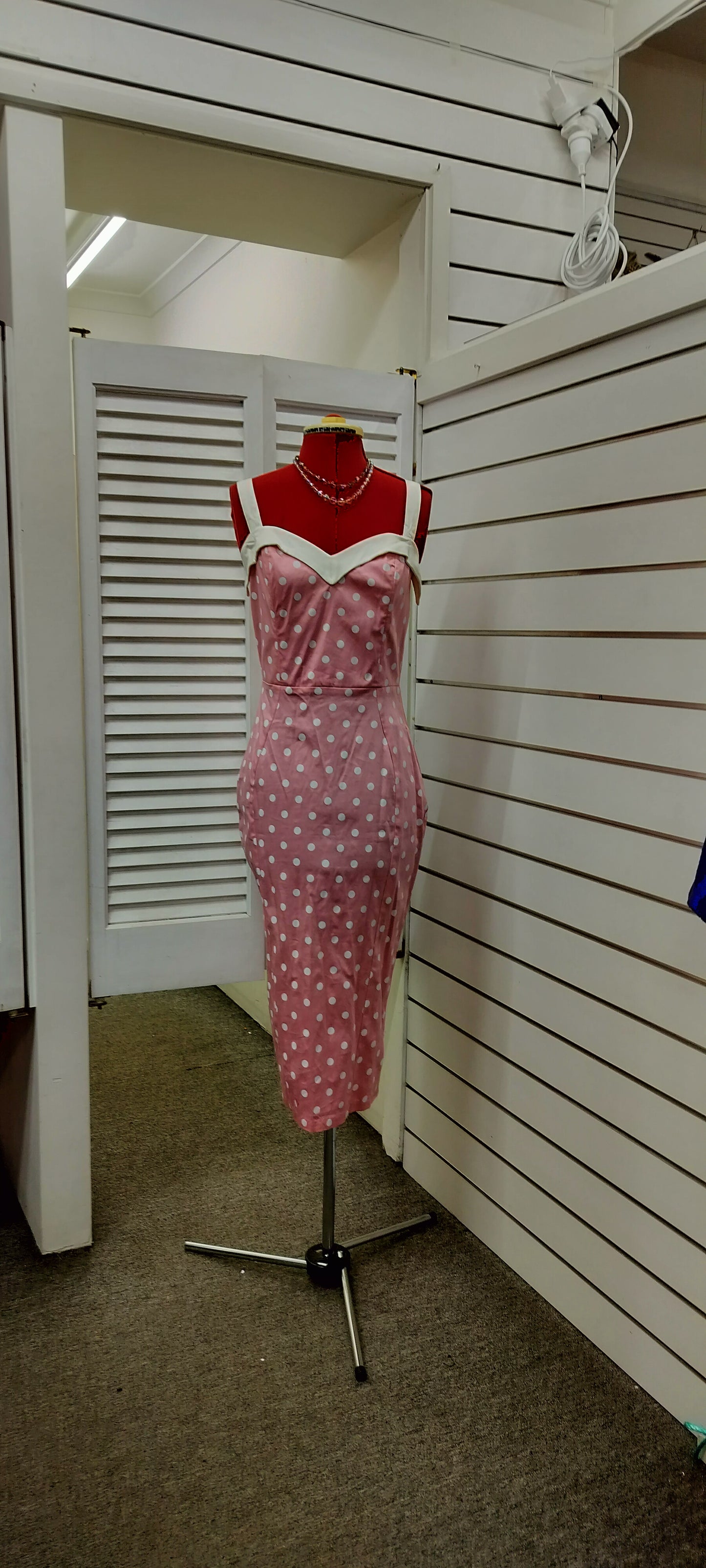 Deadly Dames label, us made, white polka dots over pink colour. Size- large.