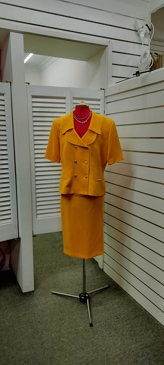 Anetha Crawford, Yellow double breasteol jacket, below knee skirt. Size-16.