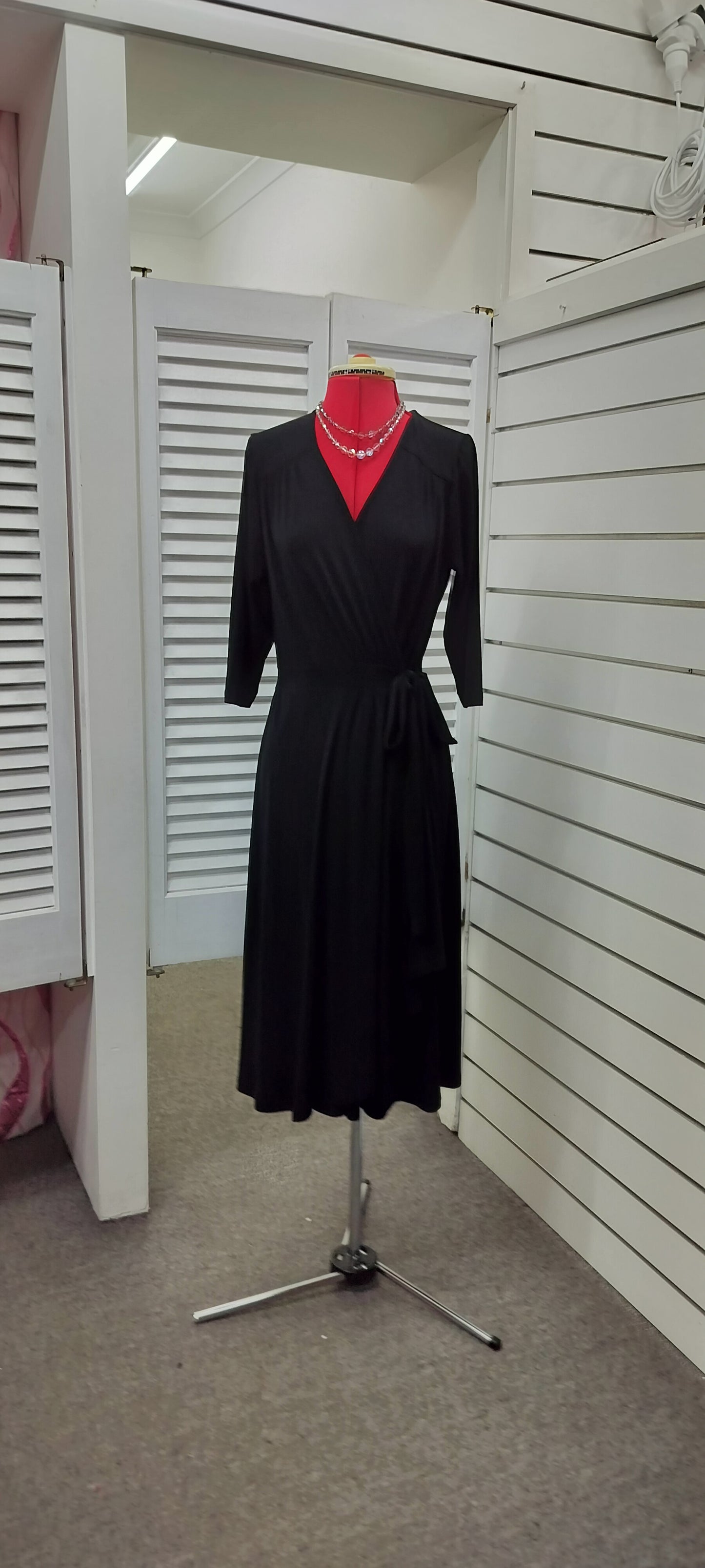 Bird by DESIGN, jersey wrap around black dress with wrap around. Size-12.