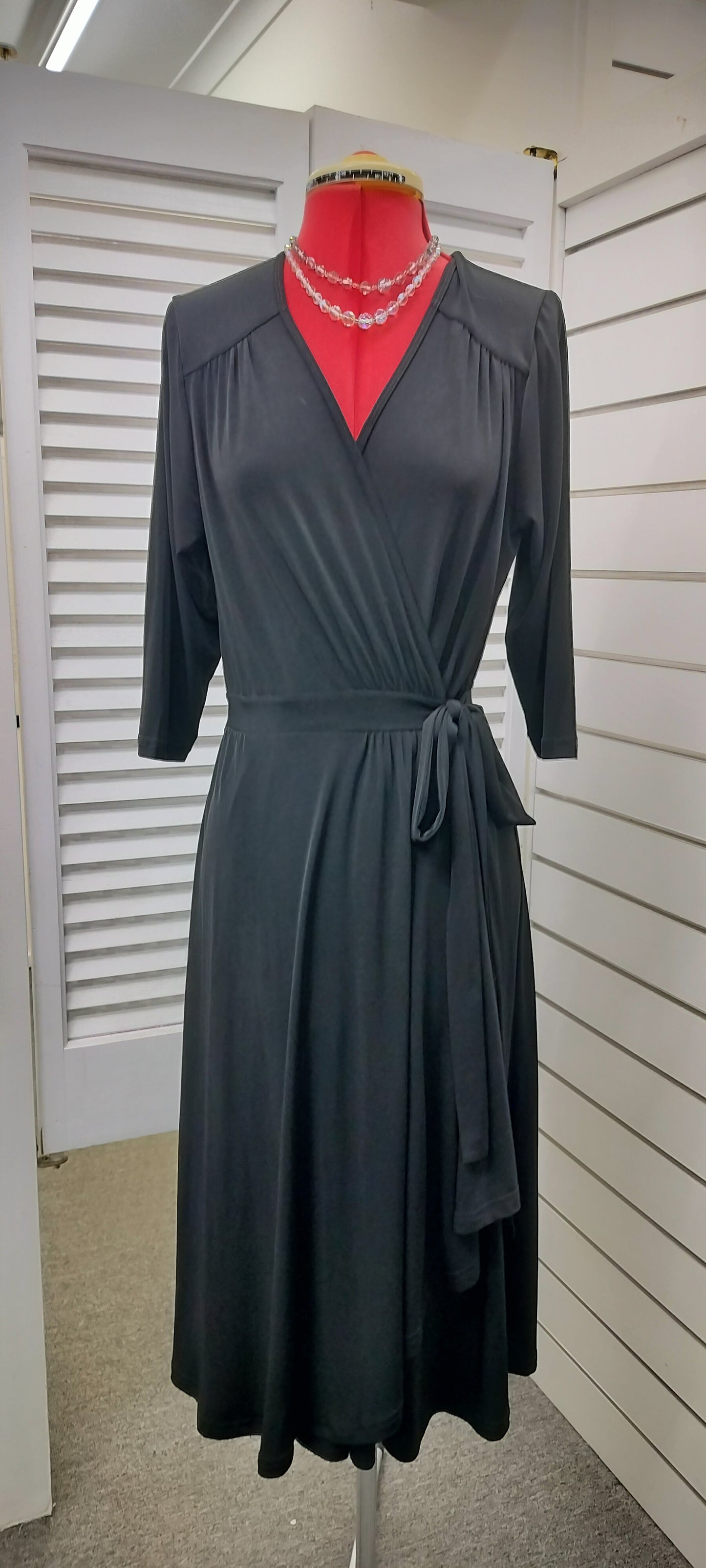 Bird by DESIGN, jersey wrap around black dress with wrap around. Size-12.