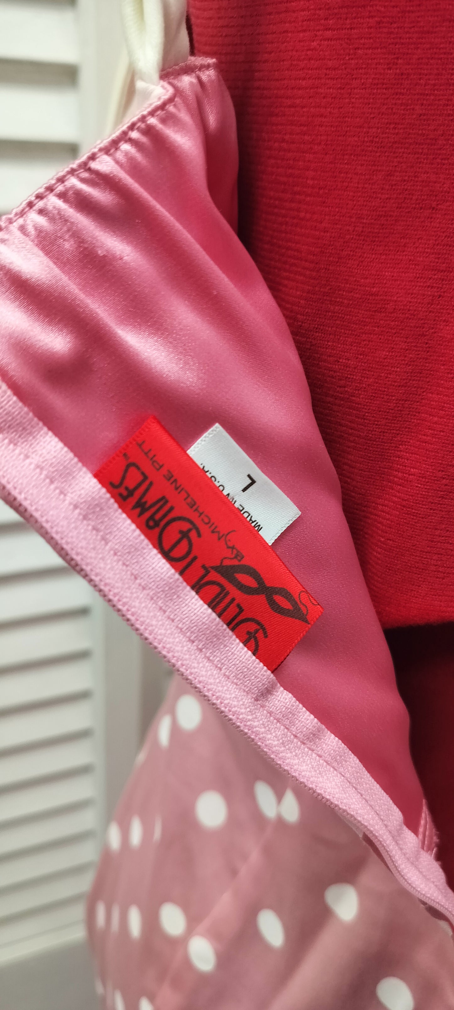 Deadly Dames label, us made, white polka dots over pink colour. Size- large.