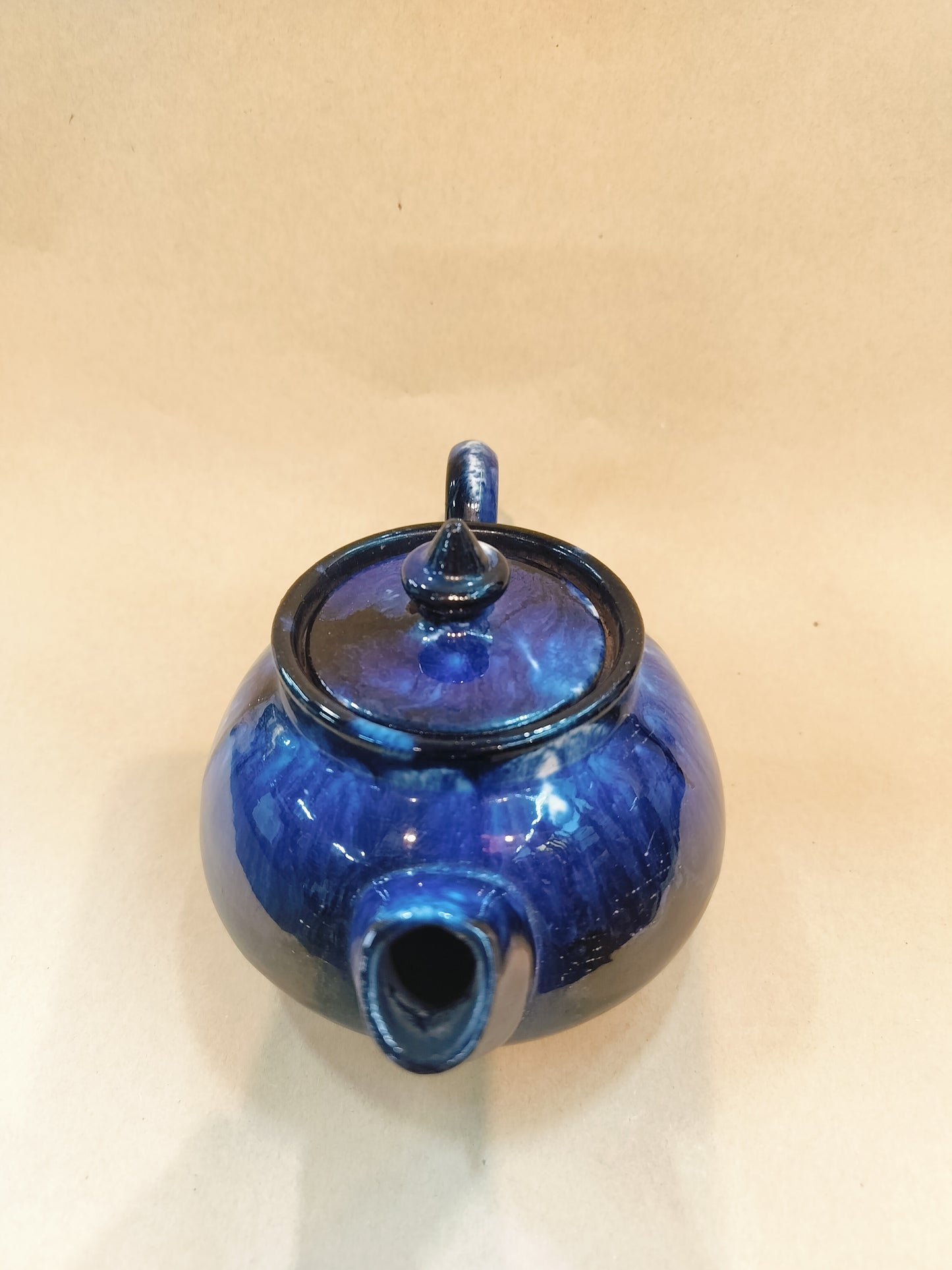Blue Pottery Teapot. Size - 3.5"x6.5", diameter- 14.2"