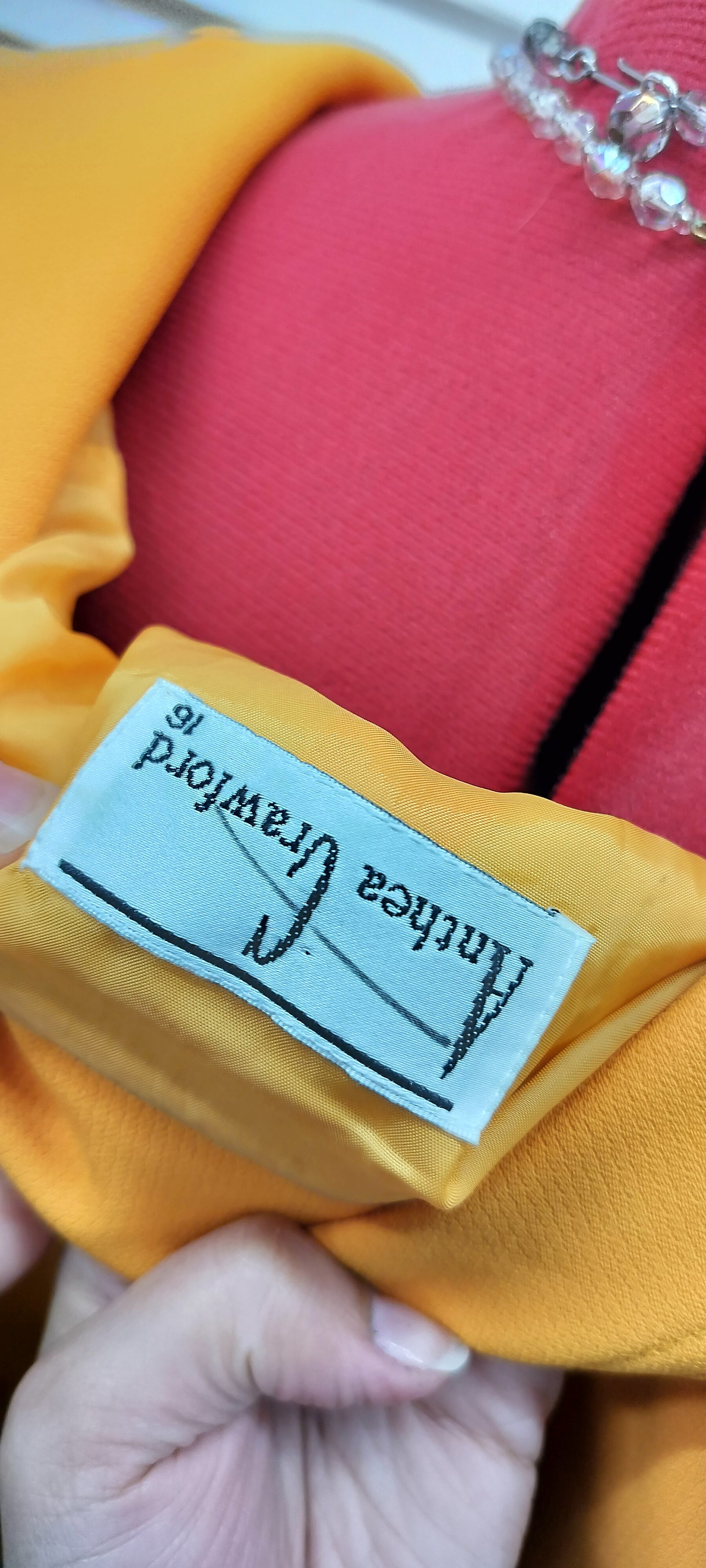 Anetha Crawford, Yellow double breasteol jacket, below knee skirt. Size-16.