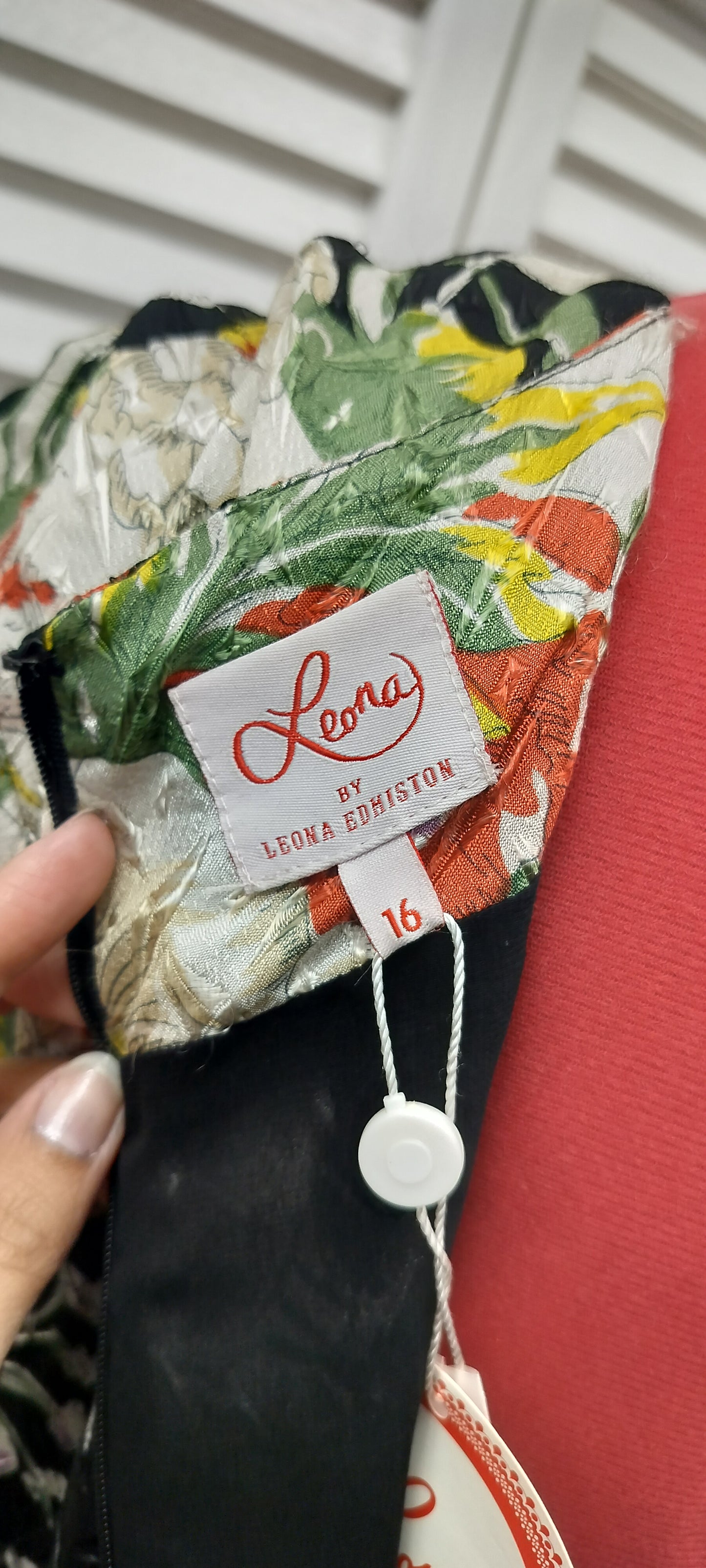 Leona Edmiston, dress with a tag on. Size-16 ( large).