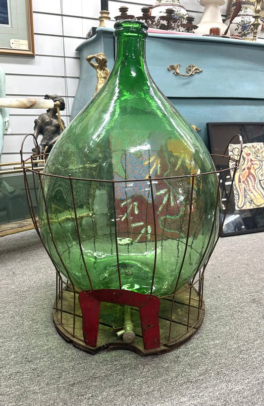 Green Demijohn glass in a metal bucket