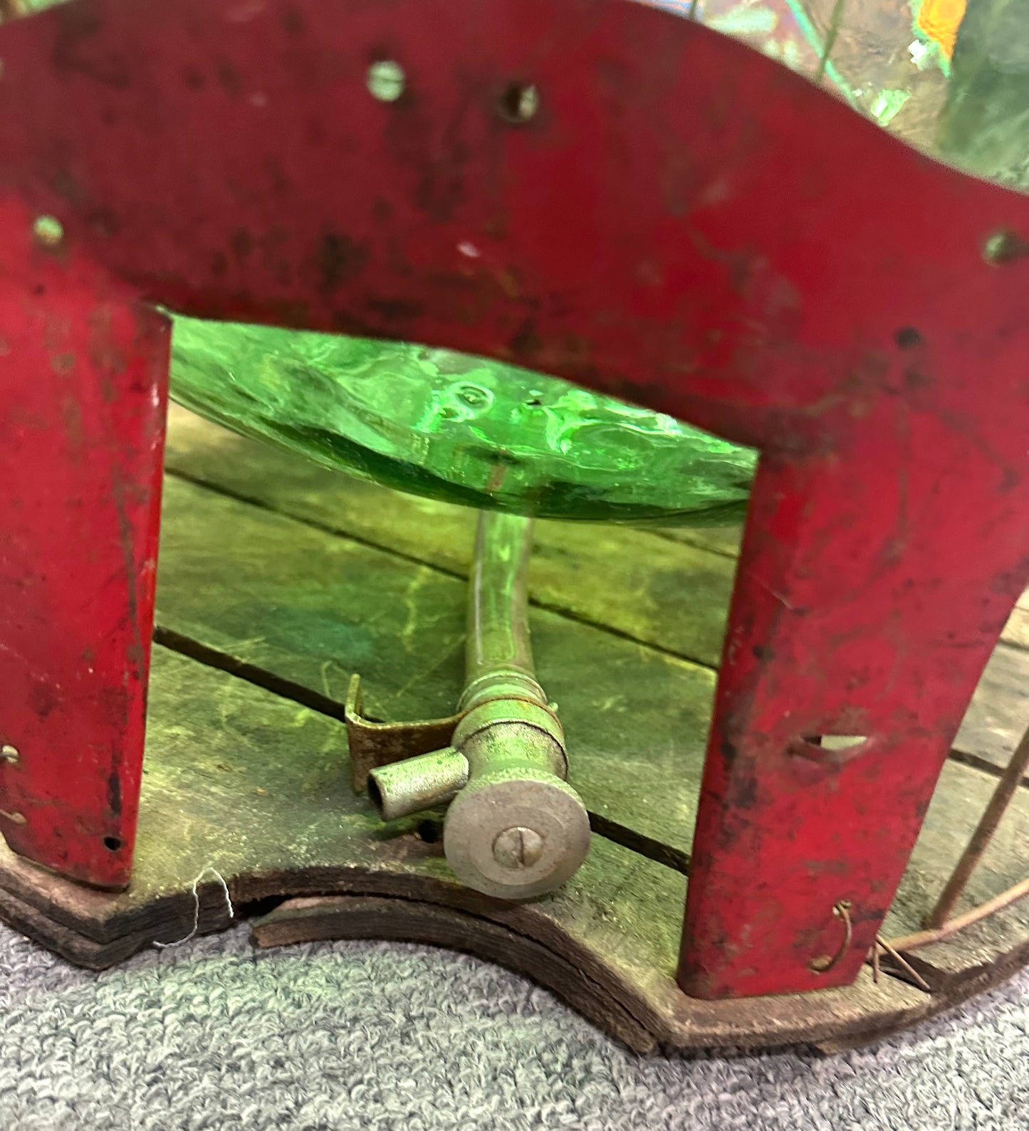 Green Demijohn glass in a metal bucket
