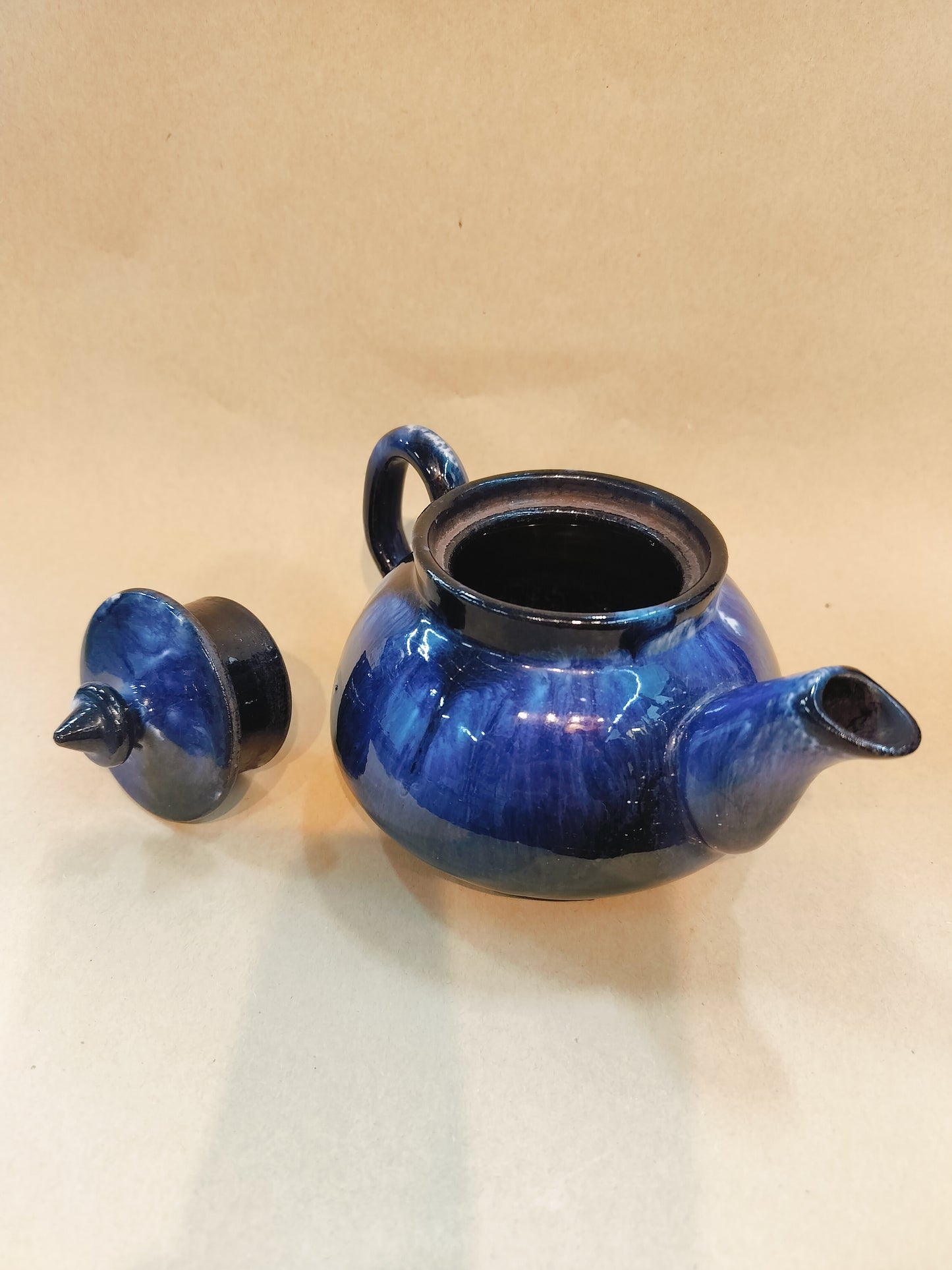 Blue Pottery Teapot. Size - 3.5"x6.5", diameter- 14.2"