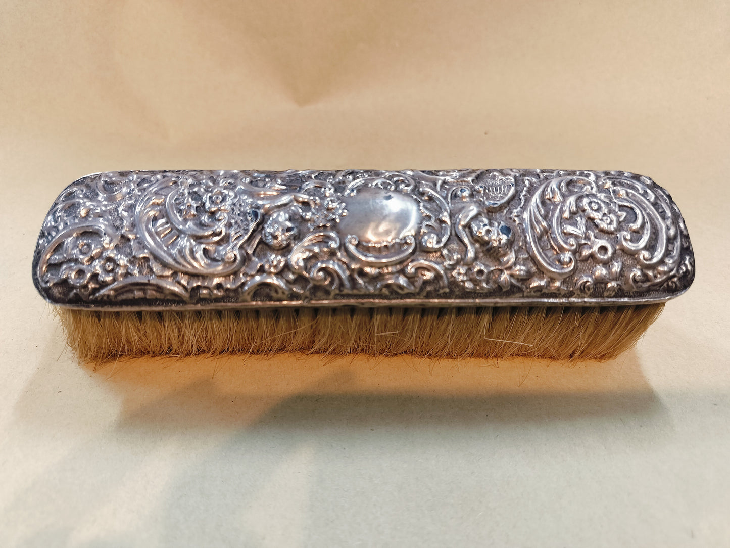Hallmarked Stirling cherub brush.