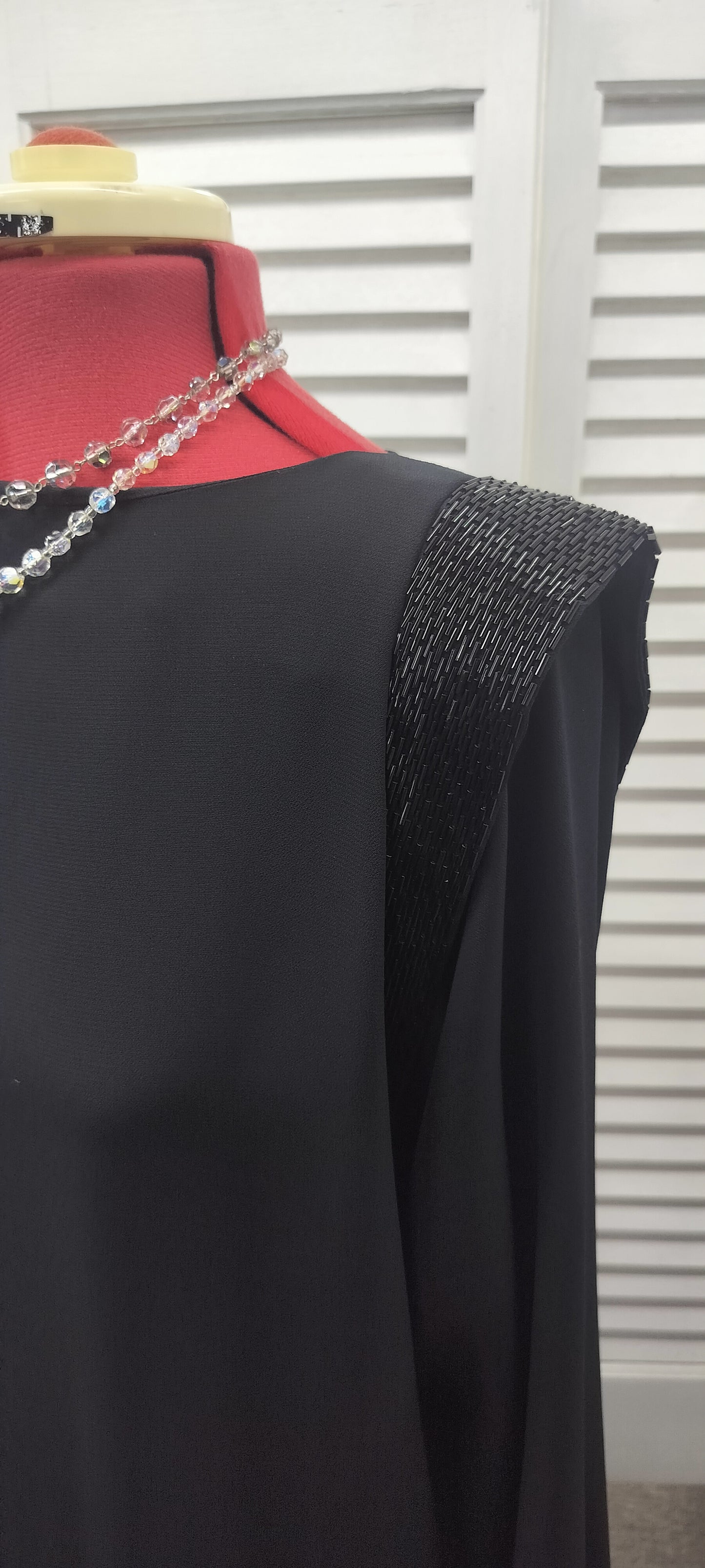 Kentsou black 80's style dress with some beading work on shoulders. Size- M-L.