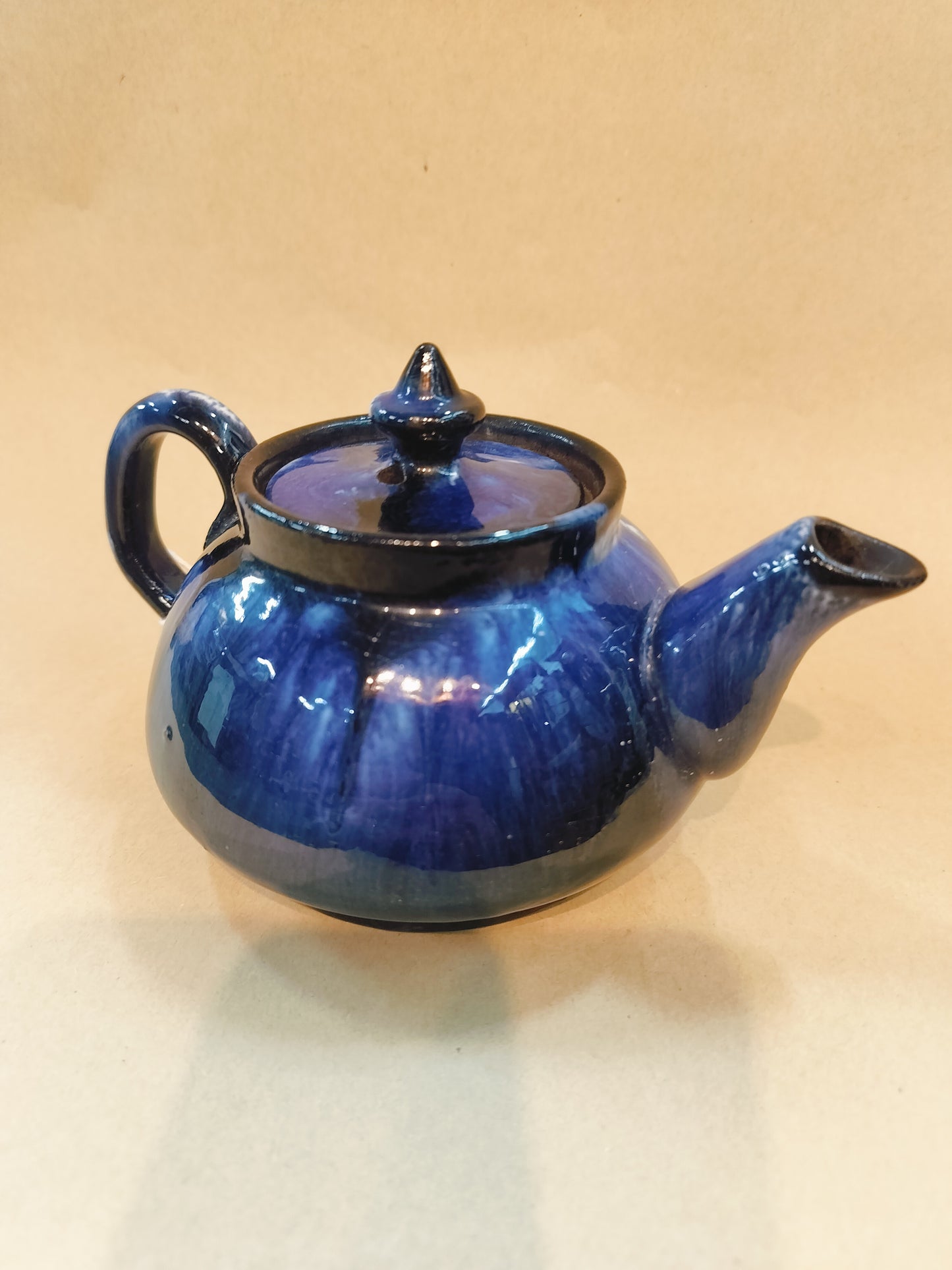 Blue Pottery Teapot. Size - 3.5"x6.5", diameter- 14.2"